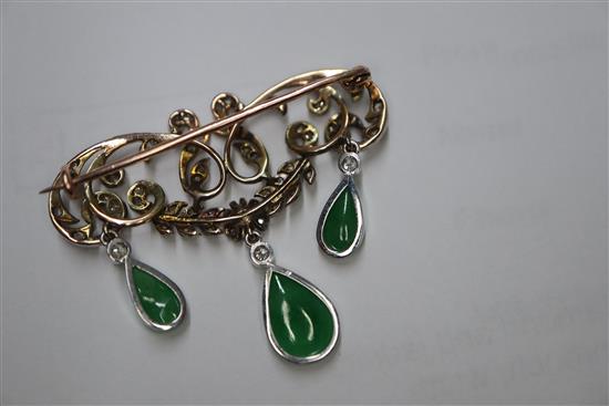 A 1920s yellow metal, diamond and jadeite set drop openwork scroll brooch, width 38mm.